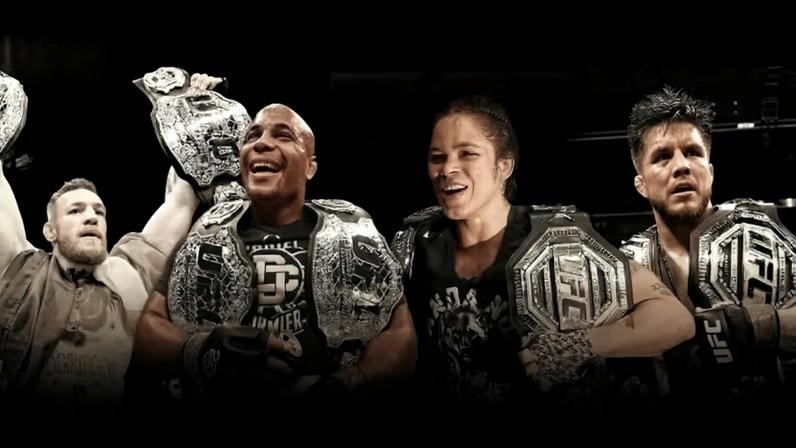 History of UFC Champ Champs featuring Randy Couture, BJ Penn, Georges St-Pierre, Conor McGregor, Daniel Cormier, Amanda Nunes and Henry Cejudo.