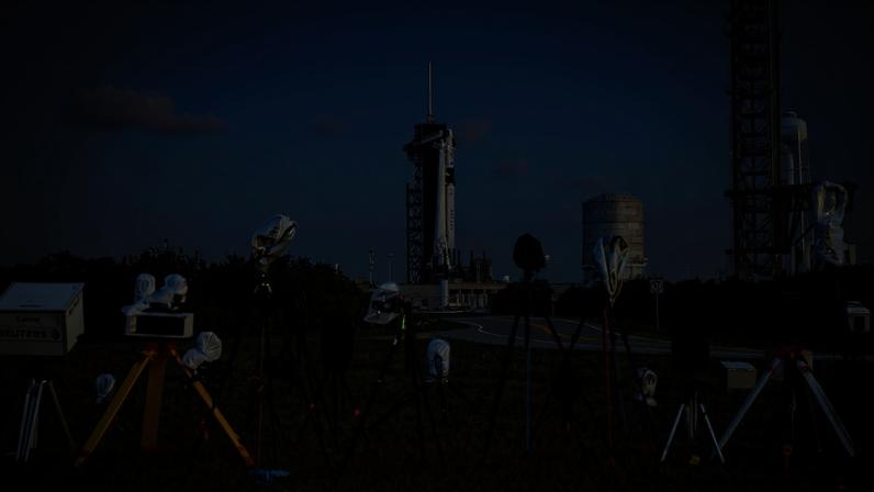 A SpaceX Falcon 9 rocket with the company's Dragon spacecraft on top is seen on the launch pad at Launch Complex 39A along with cameras set up by members of the media as preparations continue for the Crew-6 mission.