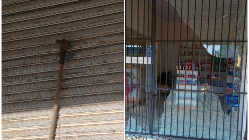 Mulher encontrou picareta pregada em portão de ferro de sua loja (Foto: Divulgação/Polícia Civil de MG)