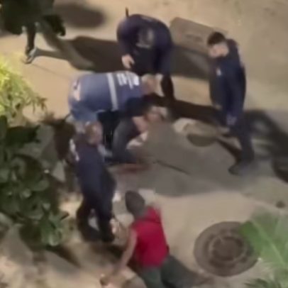 Agentes da Seop imobilizam pessoas em situação de rua após apedrejamento em Copacabana