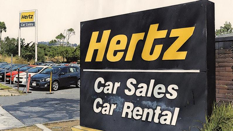 Um sinal está postado em frente a um escritório de vendas e aluguel de carros da Hertz em 8 de agosto de 2017 em South San Francisco, Califórnia. (Foto: Getty Images)