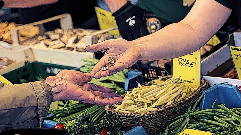 Um vendedor dá troco a um cliente em uma barraca em um mercado de agricultores em Hanau, Alemanha, no sábado, 9 de agosto de 2025. (Foto: Alex Kraus | Bloomberg | Getty Images)