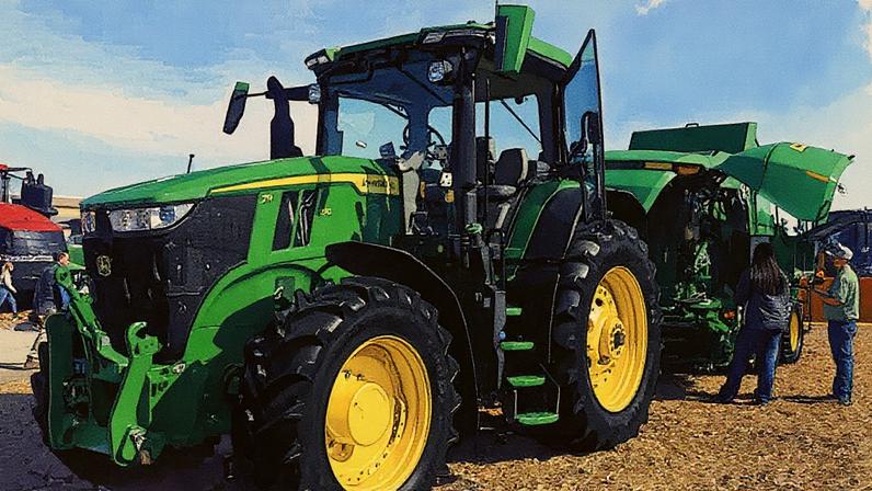 Visitantes observam um trator John Deere 7R 270 para cultivo em fileiras no estande da Deere & Co. durante a World Ag Expo no International Agri-Center em Tulare, Califórnia, em 11 de fevereiro de 2025. (Foto: Patrick T. Fallon | AFP | Getty Images)