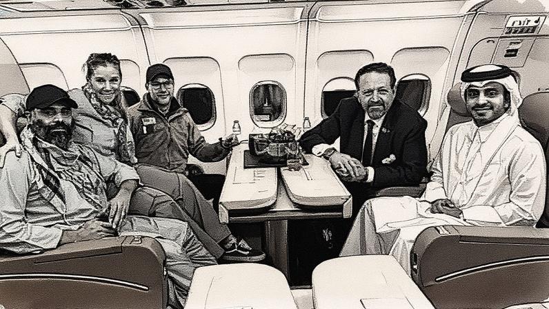 In this photo released by Qatar's foreign ministry, US citizen Amir Amiri, far left, is seen aboard a plane in Kabul, Afghanistan, on Sunday following his release by the Taliban. Photograph: AP