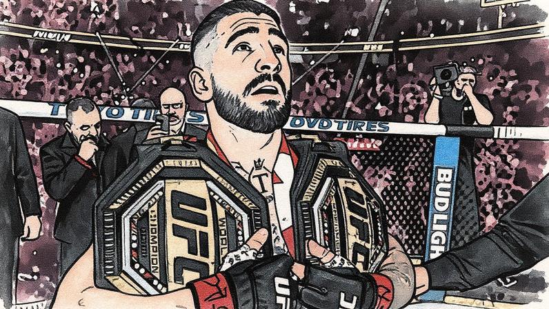 Ilia Topuria segura dois cinturões após a vitória contra Charles Oliveira na luta principal do UFC 317. (Foto por Jeff Bottari/Zuffa LLC)