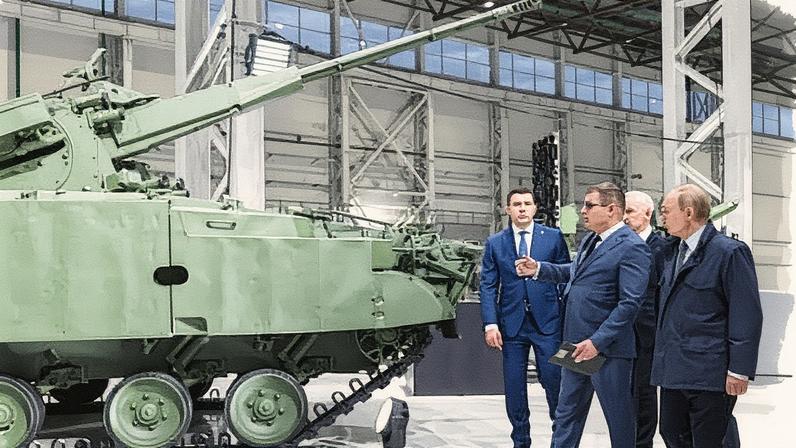 Putin visiting a military equipment manufacturer in Perm last week. Military expenditure now accounts for about 40% of the Kremlin’s total outlay.