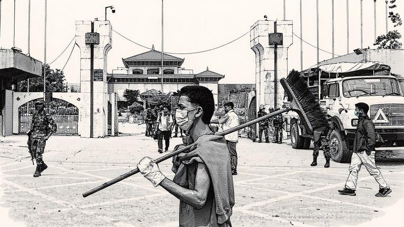 Homem caminha com uma escoba em frente ao Parlamento nepalí durante o toque de queda em Katmandú (Foto: Reprodução)