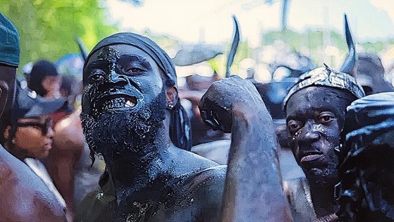 Teddy D Frederick Production/Grenada Film Company A carnival masquerader anointed in black oil in Spicemas celebrations (Credit: Teddy Dwight Frederick/ Grenada Film Co)