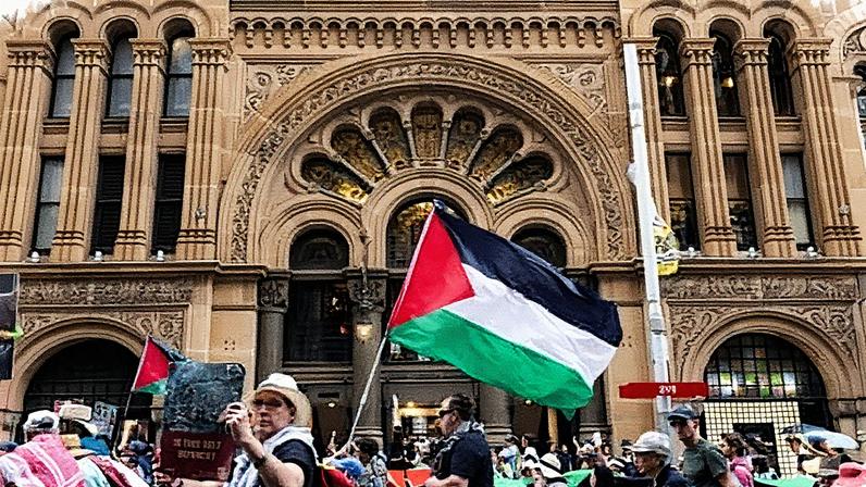 Pro-Palestine protesters march past the Queen Victoria Building in Sydney on Sunday. Photograph: Jessica Hromas/The Guardian