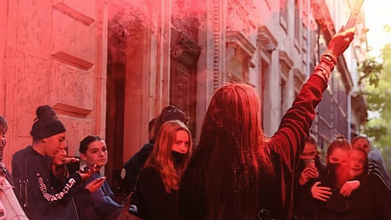 A protester holds a red flare as French students block the entrance of the Lycée Turgot high school in Paris on Thursday. Photograph: Sarah Meyssonnier/Reuters
