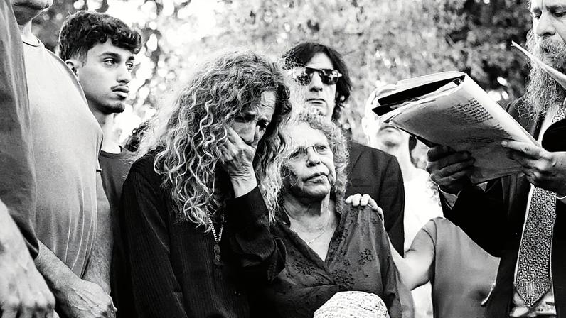 Doris Liber, Guy Illouz’s mother, mourns at his funeral in Ra’anana, Israel.