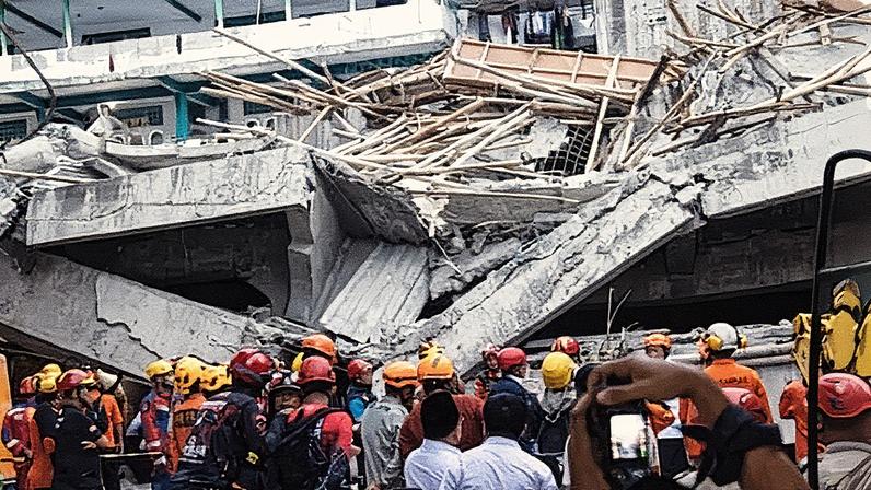 Indonesia school collapse: Rescuers search for survivors in the rubble of a collapsed building at Al Khoziny Islamic boarding school in Sidoarjo, East Java. Photograph: Robertus Pudyanto/Getty Images