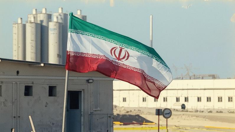 An Iranian flag fluttering at Iran's Bushehr nuclear power plant in 2019. Tehran says its nuclear power programme is energy and civil-focused.