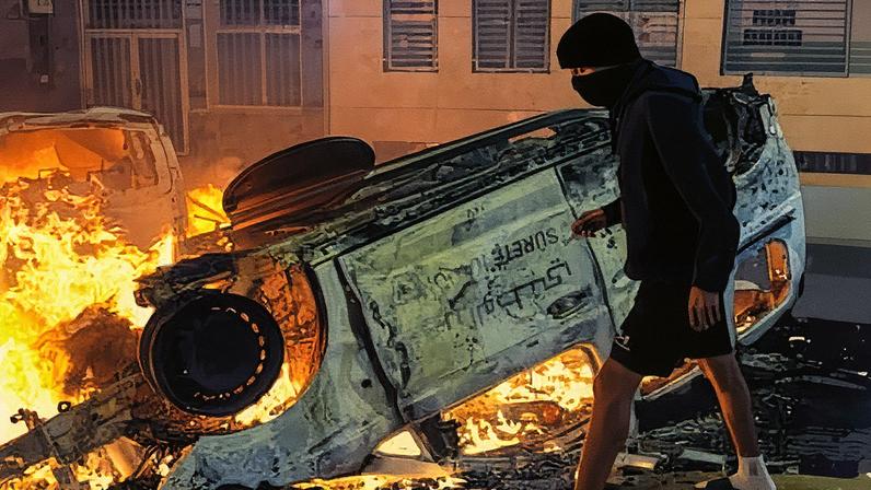 An overturned police car during a protest in the Moroccan city of Salé where witnesses say groups of young men hurled stones at police, looted shops and set fires. Photograph: Mosa’ab Elshamy/AP