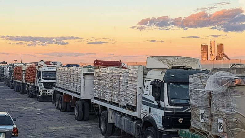 Trucks loaded with humanitarian aid on the Egyptian side of the Rafah crossing waiting to cross into Gaza on Wednesday.