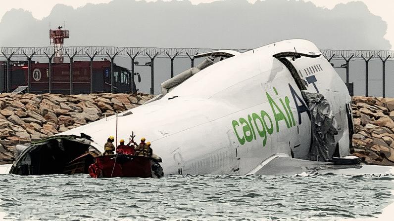 A cargo plane skids off the runway during landing at Hong Kong International Airport. Photograph: Tyrone Siu/Reuters