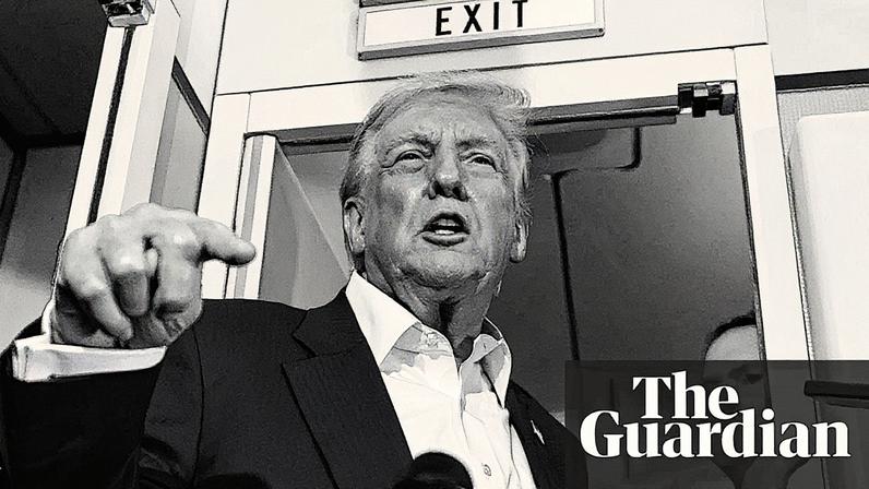 Donald Trump speaks to reporters onboard Air Force One.