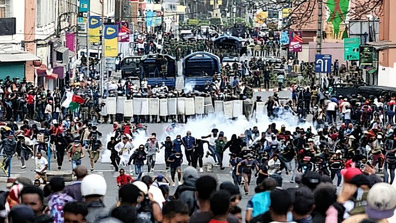 Demonstrators and police face one another on the streets of the capital, Antananarivo, on Tuesday. Photograph: Mamyrael/AP