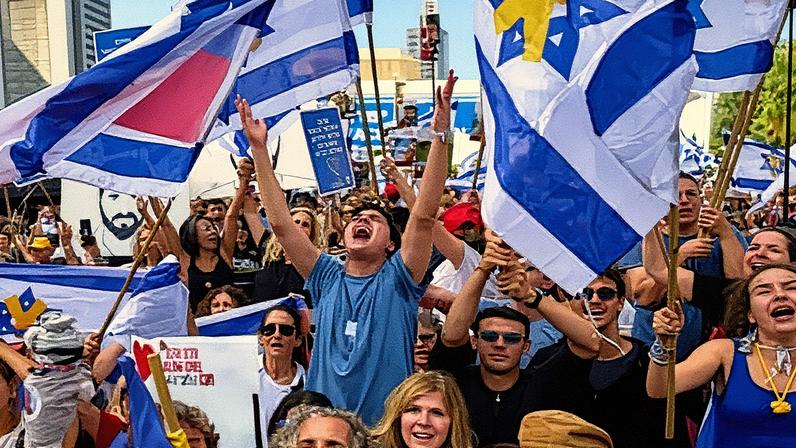 Israelis gathered in ‘hostages square’ in Tel Aviv watched a live broadcast of hostages being released by Hamas on Monday.