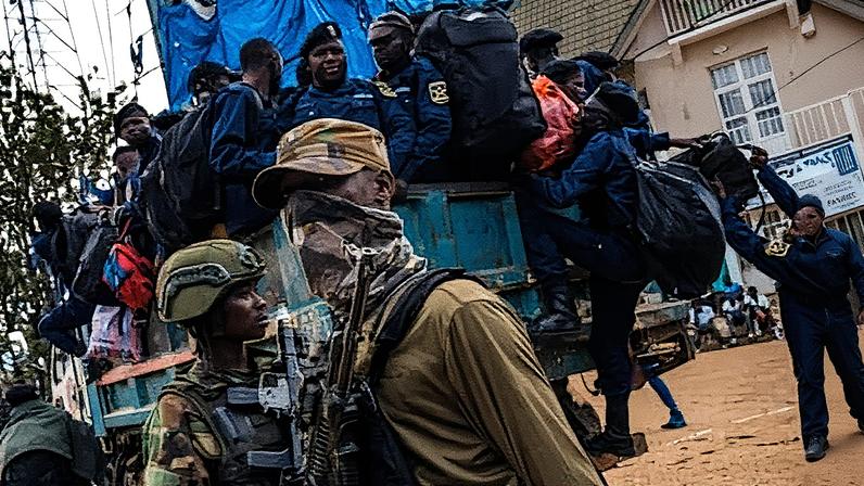 M23 rebels guard a unit of surrendering Congolese police officers in Bukavu, DRC.
