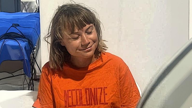 Israeli forces have also reportedly taken photographs of Greta Thunberg where she was allegedly forced to hold flags. Photograph: Israel Foreign Ministry/Reuters