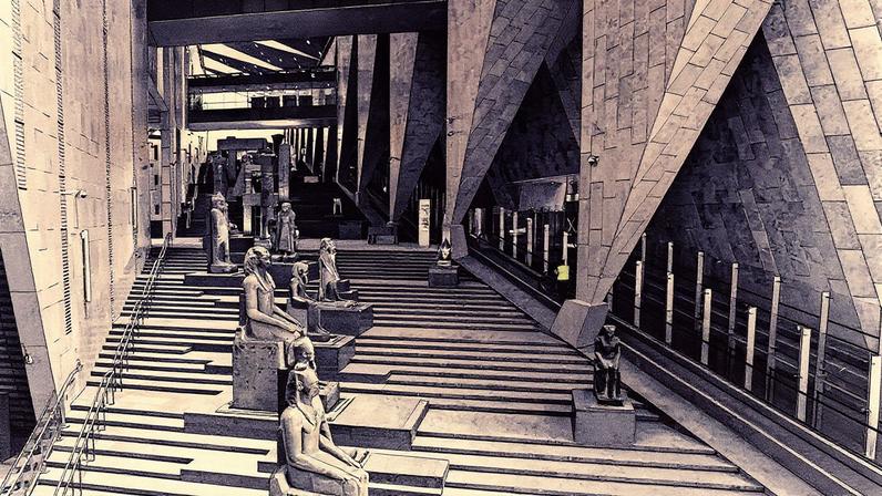 The grand staircase of the Great Egyptian Museum, which opens onto a view of the Giza pyramid complex. The official opening of the museum has been beset by multiple delays; Photo © Grand Egyptian Museum