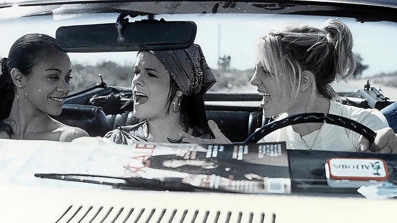 Zoe Saldana, Taryn Manning, and Britney Spears riding in car in a scene from the film 'Crossroads', 2002.