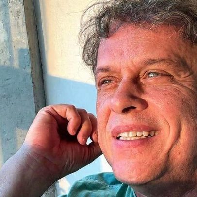 Guilherme Fontes curte praia com o filho Alexandre Jr