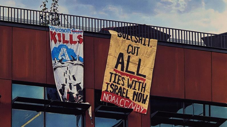 Protesters unfurled two banners at Building 6 on Microsoft’s campus on Thursday.