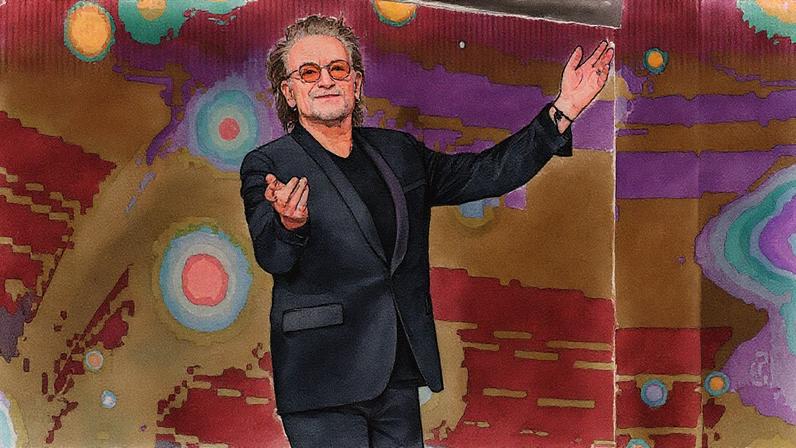 U2 singer and frontman Bono speaks on stage at the Woody Guthrie Prize ceremony.
