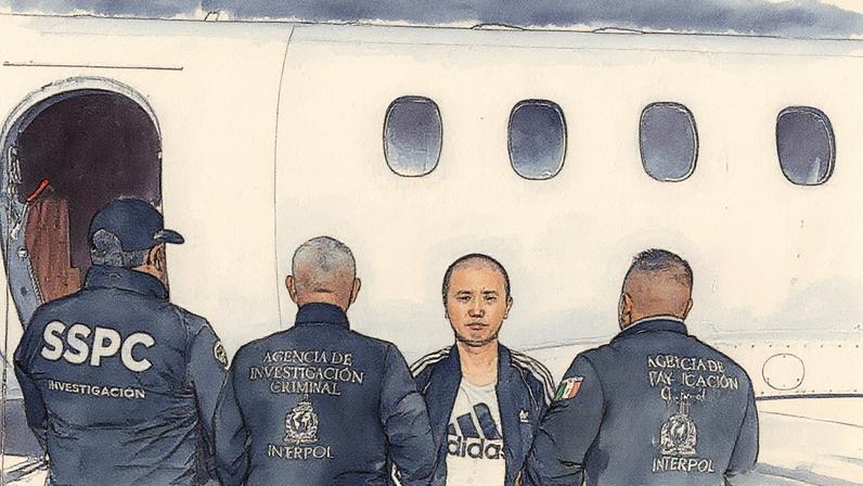 Zhi Dong Zhang, known by the alias ‘Brother Wang’, is escorted by Interpol officers in Mexico City last month.