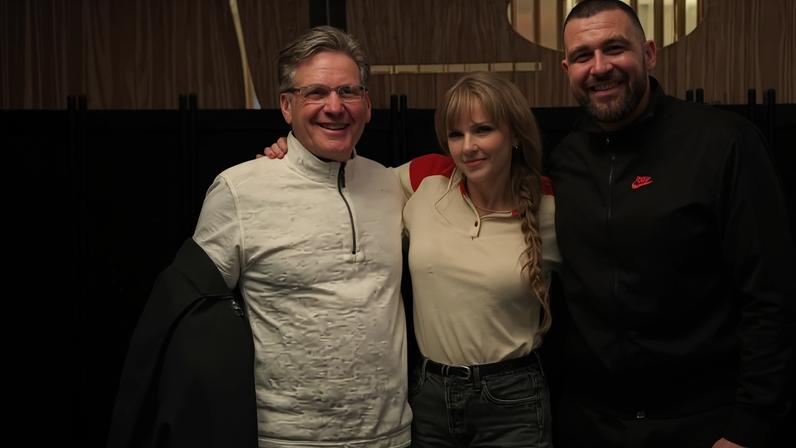 Taylor Swift cozied up to Travis Kelce in a group photo from Sunday. therealholzwife/Instagram