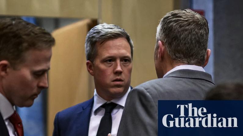 The US secretary of the army, Daniel Driscoll, center, speaks with US staff after talks with the Ukrainian delegation in Geneva at the weekend. Photograph: Fabrice Coffrini/AFP/Getty Images
