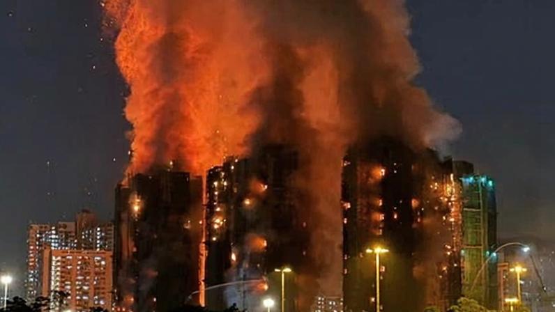 Thick smoke and flames rise as a fire engulfs several blocks of flats at the Wang Fuk Court estate in Hong Kong's Tai Po district on Wednesday. Photograph: Yan Zhao/AFP/Getty Images