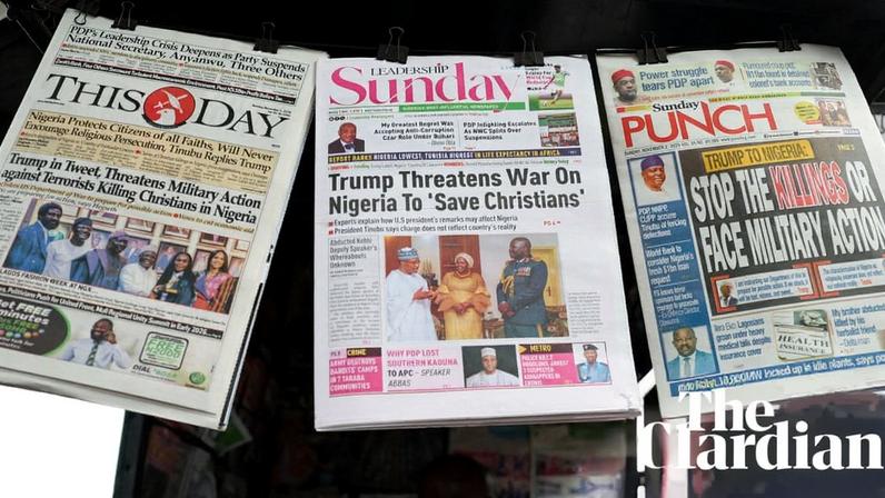 Front pages of newspapers in Lagos, Nigeria, report Donald Trump’s threat to launch a ‘guns-a-blazing’ military intervention in Nigeria for failing to prevent attacks on Christians. Photograph: Sodiq Adelakun/Reuters