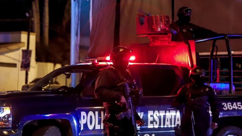 Sinaloa state police agents stand guard during a security operation in the city of Culiacan, Sinaloa state, Mexico on 15 February 2019. Photograph: Rashide Frias/AFP/Getty Images