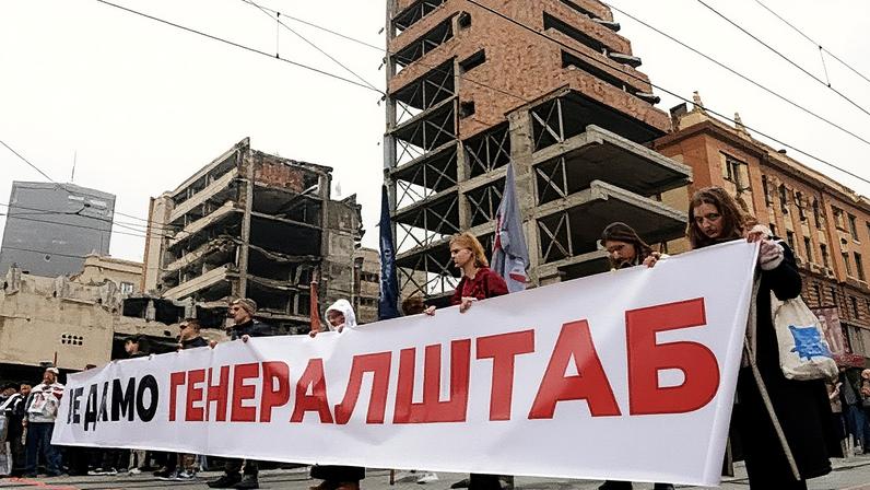 People hold a banner during a rally protesting a law permitting a property development linked to Jared Kushner on the site of the former General Staff Building, a local landmark, in Belgrade, Serbia