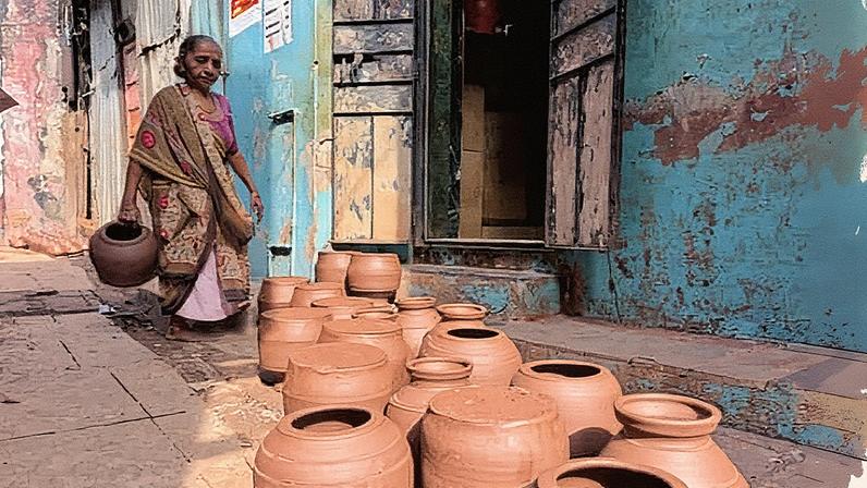 The clay artisans of Dharavi leave their pots to dry outside their homes. Photograph: Aakash Hassan/the Guardian