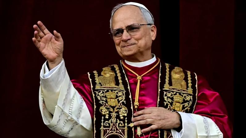 Pope Leo XIV waves from the central balcony of St. Peter's Basilica in the Vatican on May 8.