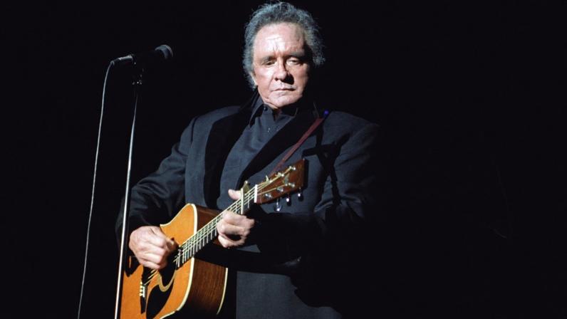 Johnny Cash performs on June 14, 1997.