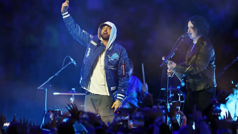 Jack White and Eminem perform during the halftime show of the game between the Green Bay Packers and the Detroit Lions on November 27, 2025 in Detroit, Michigan.