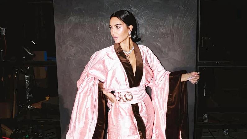 Kim Kardashian shared behind-the-scenes photos in a pink kimono from “All’s Fair.”