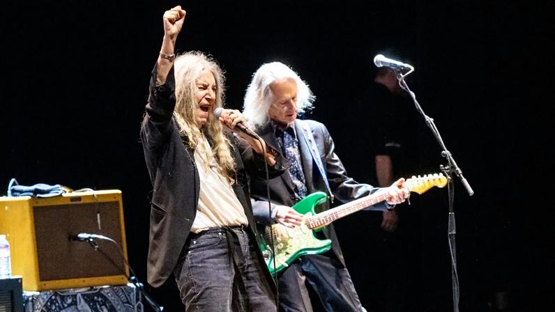 Patti Smith (L) and Lenny Kaye perform the album "Horses' live on stage during the 50th anniversary tour at Paramount Theatre on November 10, 2025 in Seattle, Washington.