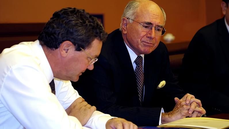 Former foreign affairs minister Alexander Downer and former prime minister John Howard in a cabinet meeting in February 2005. Planning for an global influenza pandemic reached all the way to the national security committee in October 2005, cabinet papers show.