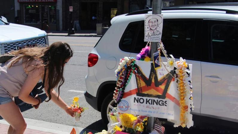 A person on 17 June lays flowers at a makeshift memorial for Arthur ‘Afa’ Ah Loo on the Salt Lake City block where Ah Loo was fatally shot.