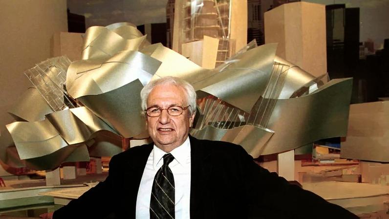 Frank Gehry with the model of the new Guggenheim Museum.