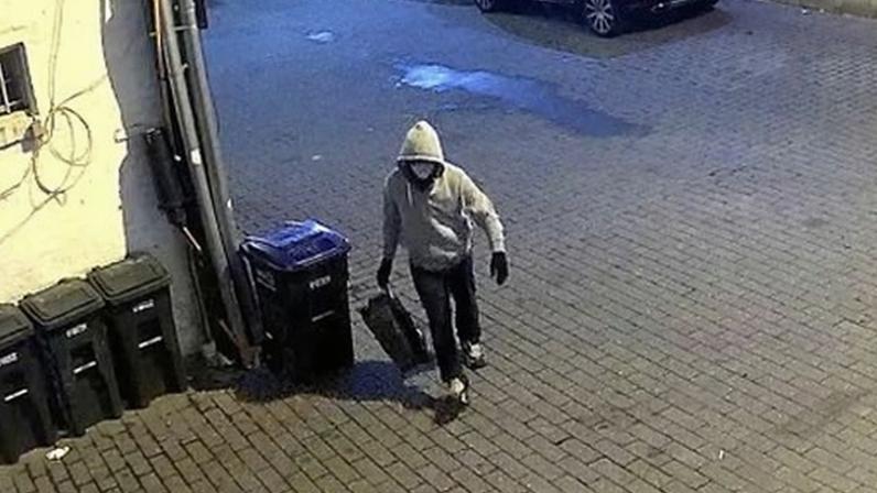 A surveillance photo released by the FBI shows a person suspected in the attempted pipe bomb attack.