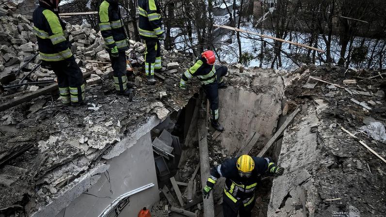Rescuers work at the site of the apartment building hit by a Russian drone during a Russian missile and drone strike, amid Russia's attack on Ukraine, in Kyiv, Ukraine December 27, 2025. REUTERS/Viacheslav Ratynskyi