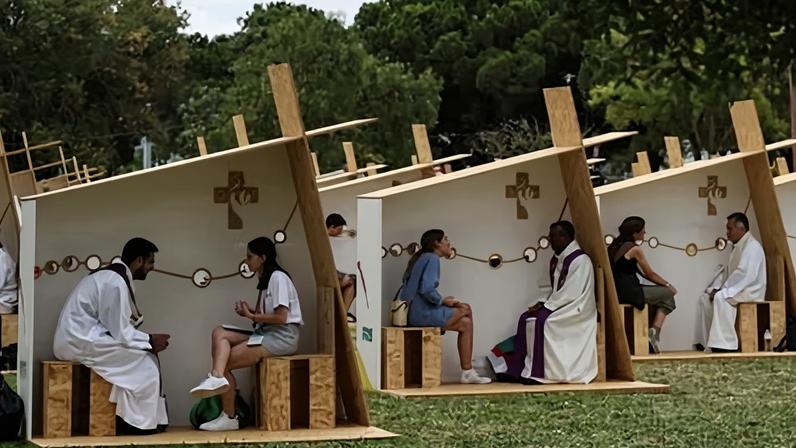 People confess to priests during Pope Francis’s visit to Portugal in August 2023.
