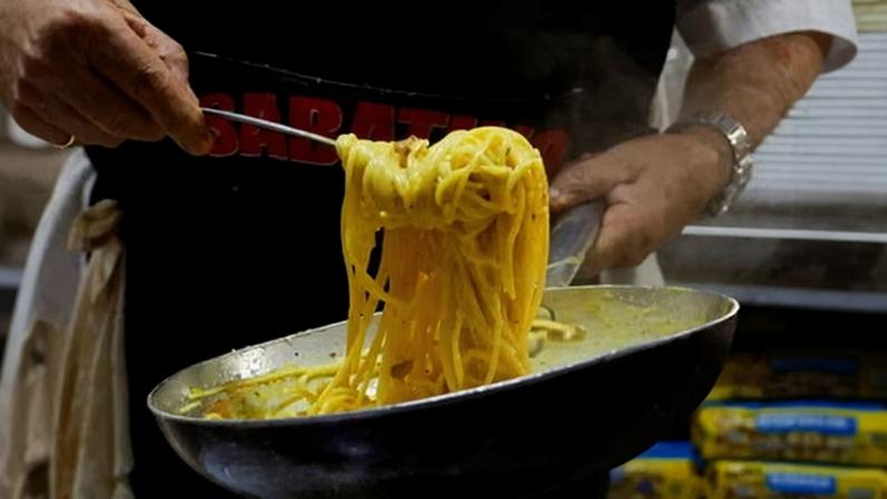 A chef prepares a carbonara at a restaurant in Rome. Photograph: Remo Casilli/Reuters